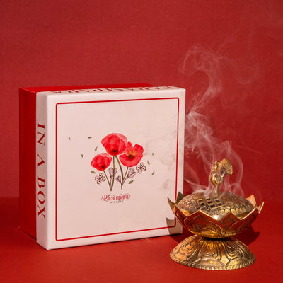 Stem brass burner releasing sacred smoke during worship